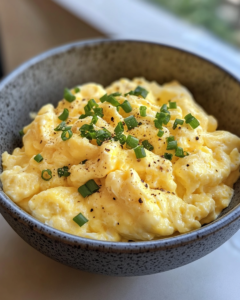 Discover the secret ingredient that transforms ordinary scrambled eggs into a creamy, flavorful delight. Elevate your breakfast today!